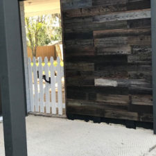 Exterior patio with reclaimed wood wall