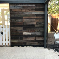 Exterior patio with reclaimed wood wall